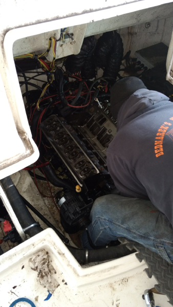 Mechanic Servicing Engine